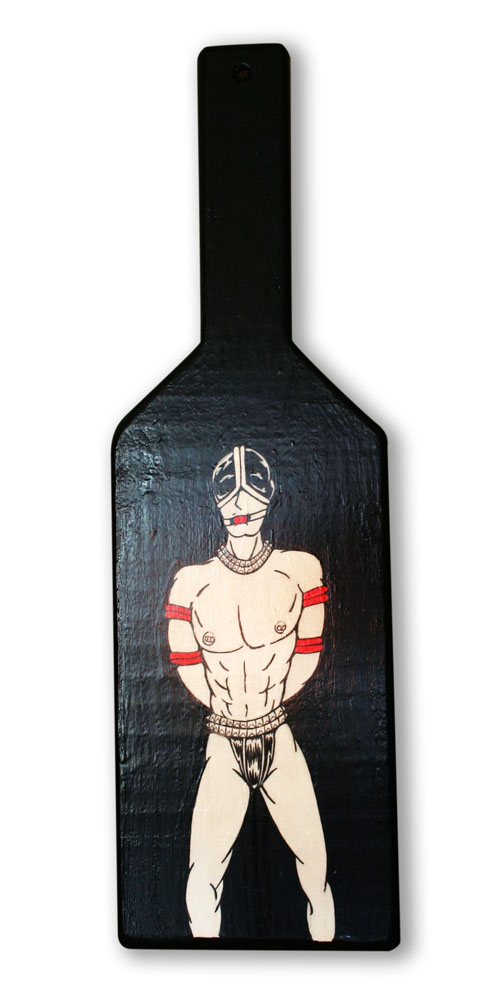 Muscle Leather Man in bondage on paddle